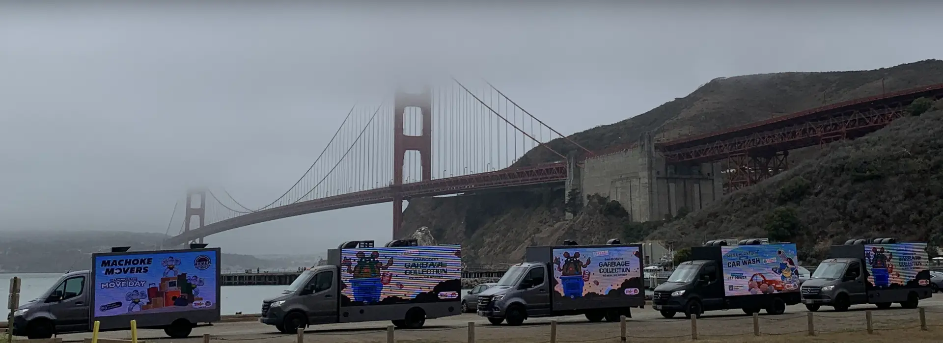 Adbox mobile LED billboard fleet lined up near the Golden Gate Bridge